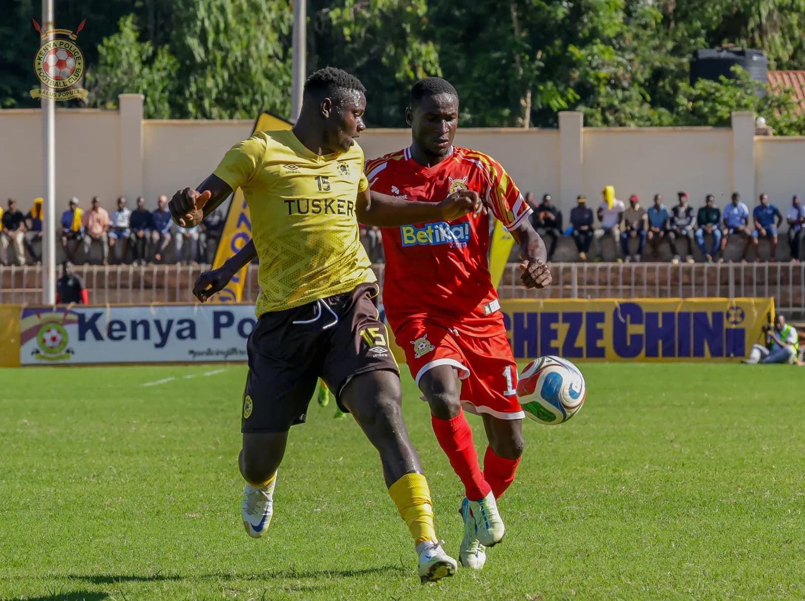 A Kenya Police player shields the ball from a Tusker defender in the cup final