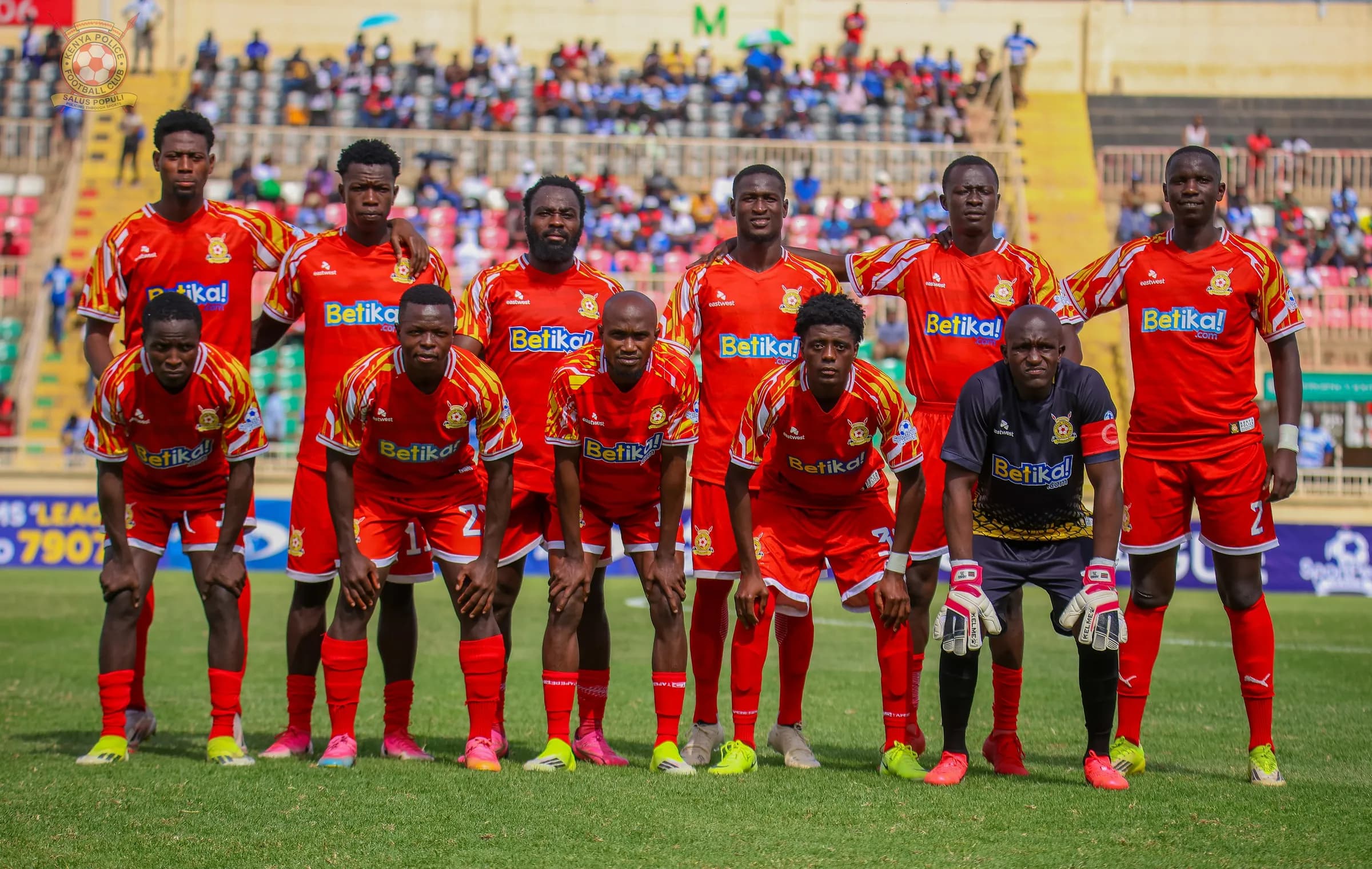 The Kenya Police FC starting eleven lined up in red home kits before kick off